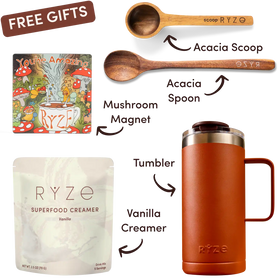 Collection of RYZE products including a tumbler, superfood creamer, mushroom magnet, and wooden scoop and spoon on a white background.
