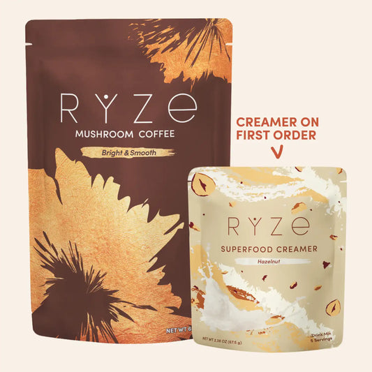 Ryze Mushroom Coffee in a large brown and gold stand-up pouch next to a smaller cream-colored pouch labeled Superfood Creamer, with text reading 'Creamer on first order' on a light beige background.