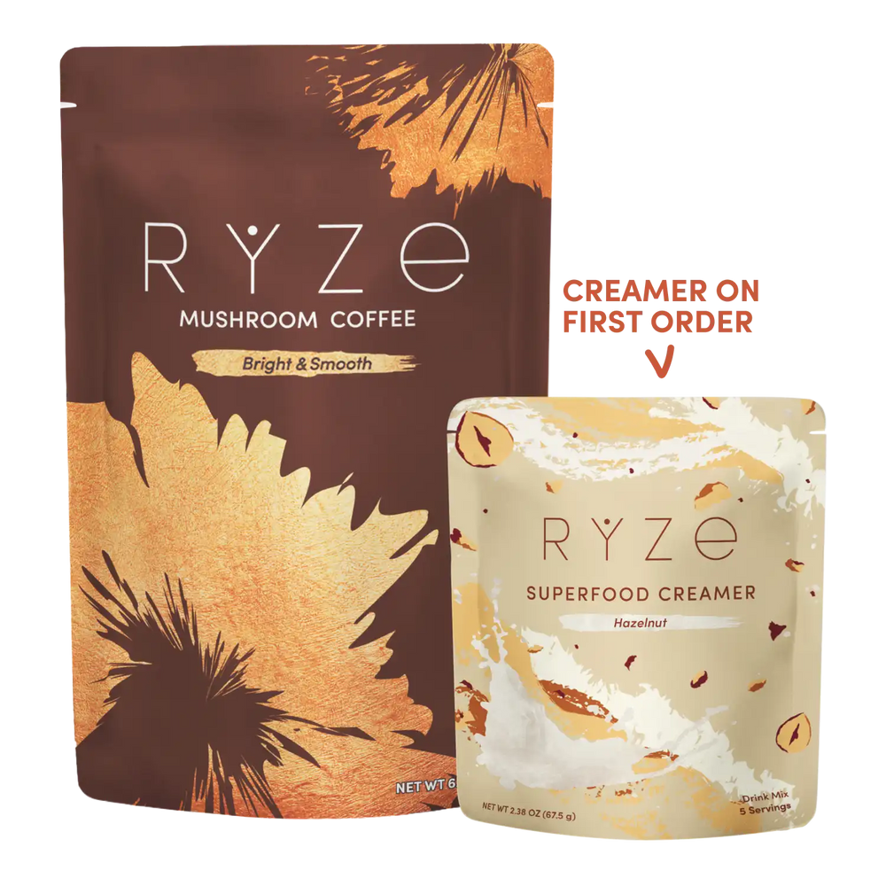 Ryze Mushroom Coffee in a large brown and gold stand-up pouch next to a smaller creamer pouch, with a red text callout reading 'CREAMER ON FIRST ORDER' on a white background.