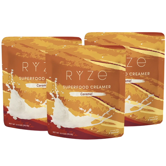 Three packages of RYZé Superfood Creamer Caramel on a white background