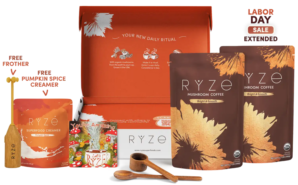 Ryze Labor Day gift box set featuring mushroom coffee pouches, a superfood creamer pouch, a free pumpkin spice creamer bottle, a wooden spoon, and an open orange gift box on a white background with a 'Labor Day Sale Extended' badge.