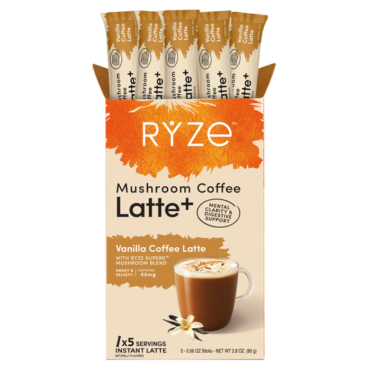 A box of RYZE Mushroom Coffee Latte+ Vanilla Coffee Latte instant coffee sticks, showing the front packaging and five individual stick packs inside a cardboard display.