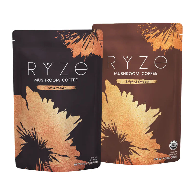 Two stand-up pouches of RYZE Mushroom Coffee on a plain white background. The left pouch is dark brown with black and gold leaf-like graphics and reads 'RYZE MUSHROOM COFFEE Rich & Robust.