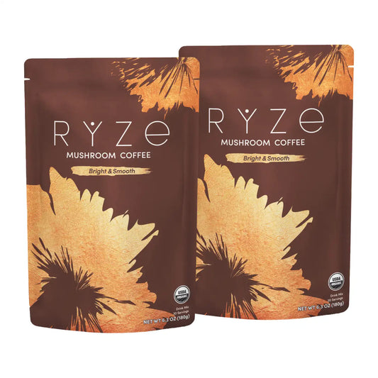 Two stand-up pouches of RYZE Mushroom Coffee, Bright & Smooth flavor, displayed against a plain white background.