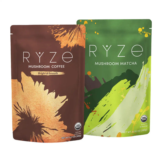 Two stand-up pouches of RYZE organic mushroom coffee and matcha shown side by side on a white background. The left pouch is brown with orange and black brushstroke graphics and reads 'RYZE MUSHROOM COFFEE Bright & Smooth.