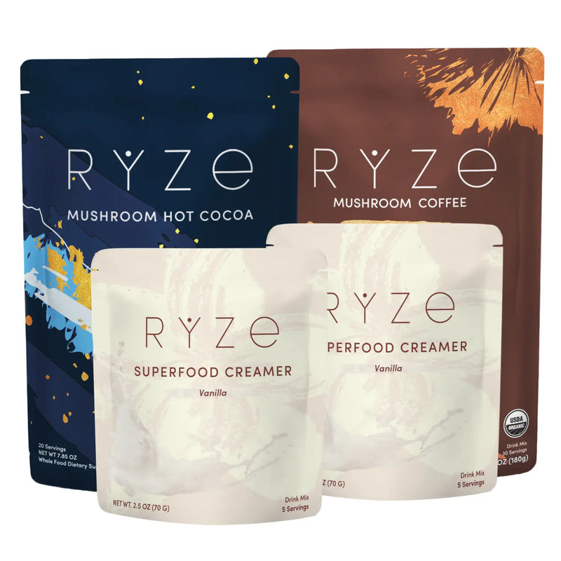 Four RYZE beverage pouches arranged together on a white background: a dark blue Mushroom Hot Cocoa pouch, a brown Mushroom Coffee pouch, and two pale cream pouches labeled Superfood Creamer, with vanilla text on the front.